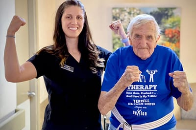 Staff and resident enjoying a fitness activity