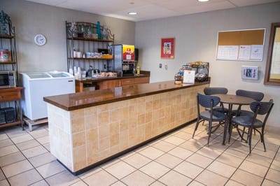 Bright interior cafe area with seating and refreshments