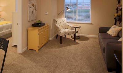 Cozy interior living space with a chair and sofa
