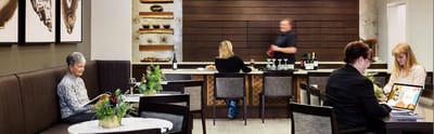 Residents enjoying drinks in a stylish common area
