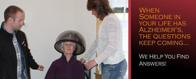 Staff assisting a resident with hair care