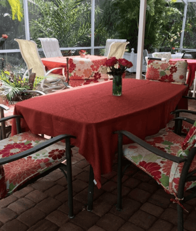 Outdoor seating area with floral tablecloth and chairs