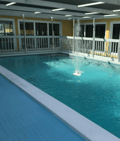 Indoor pool area with clear blue water