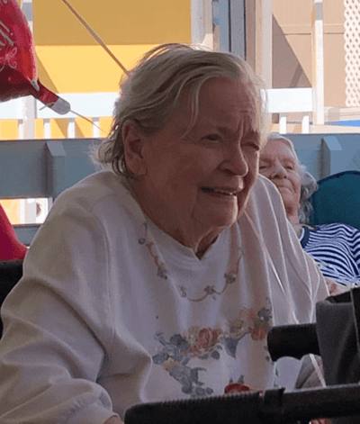Senior resident smiling in a common area