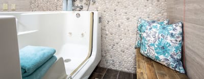 Accessible bathroom with grab bars and seating