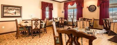 Elegant dining room with dark wood furniture and decor