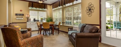 Bright common area with seating and dining table