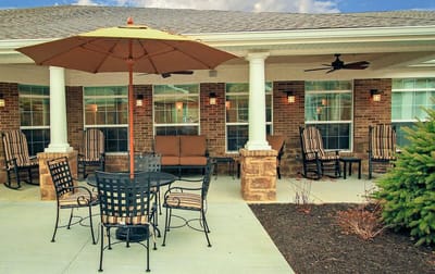 Outdoor seating area with umbrella and chairs