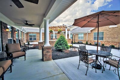 Outdoor patio area with seating and landscaping
