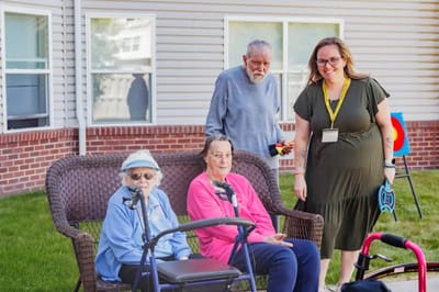 Residents enjoying time outdoors on a bench