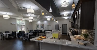 Bright dining area with food and tables set up