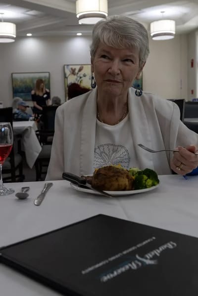 Senior enjoying a meal in the dining room