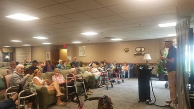 Residents enjoying a live music performance in a common area