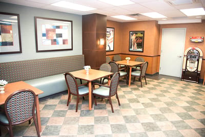 Bright dining area with tables and chairs