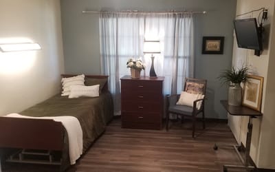 Cozy private resident room with bed and decor