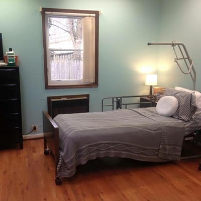 Private resident room with a hospital bed and decor
