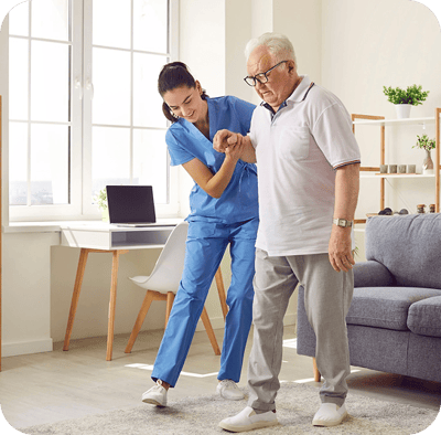 Staff assisting a senior resident in a sunny room
