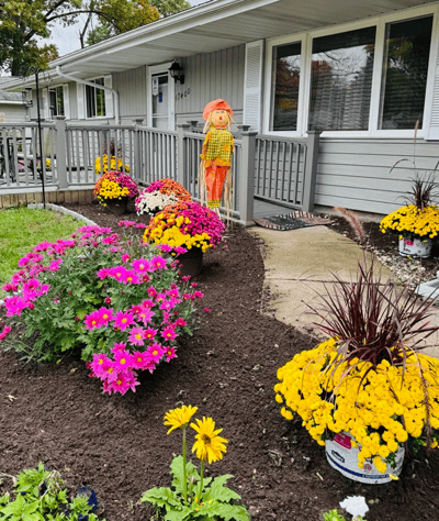Exterior view of the facility with vibrant flowers
