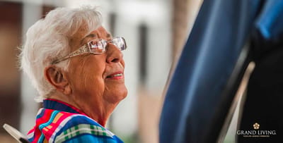 A senior resident smiling during a conversation