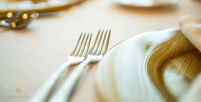 Close-up of elegant dining table setting with forks