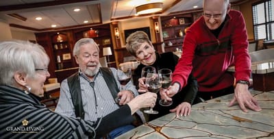Residents socializing and toasting in a common area