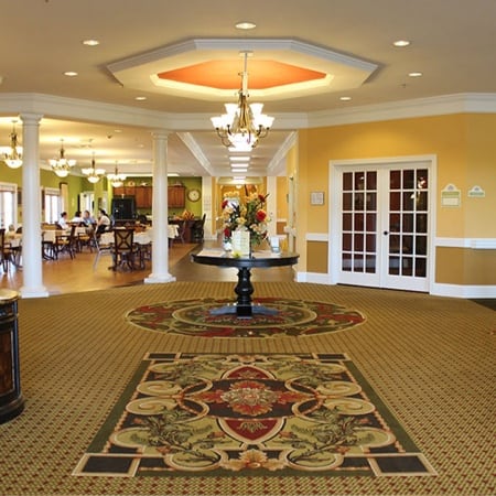 Interior lobby area with decorative flooring and seating