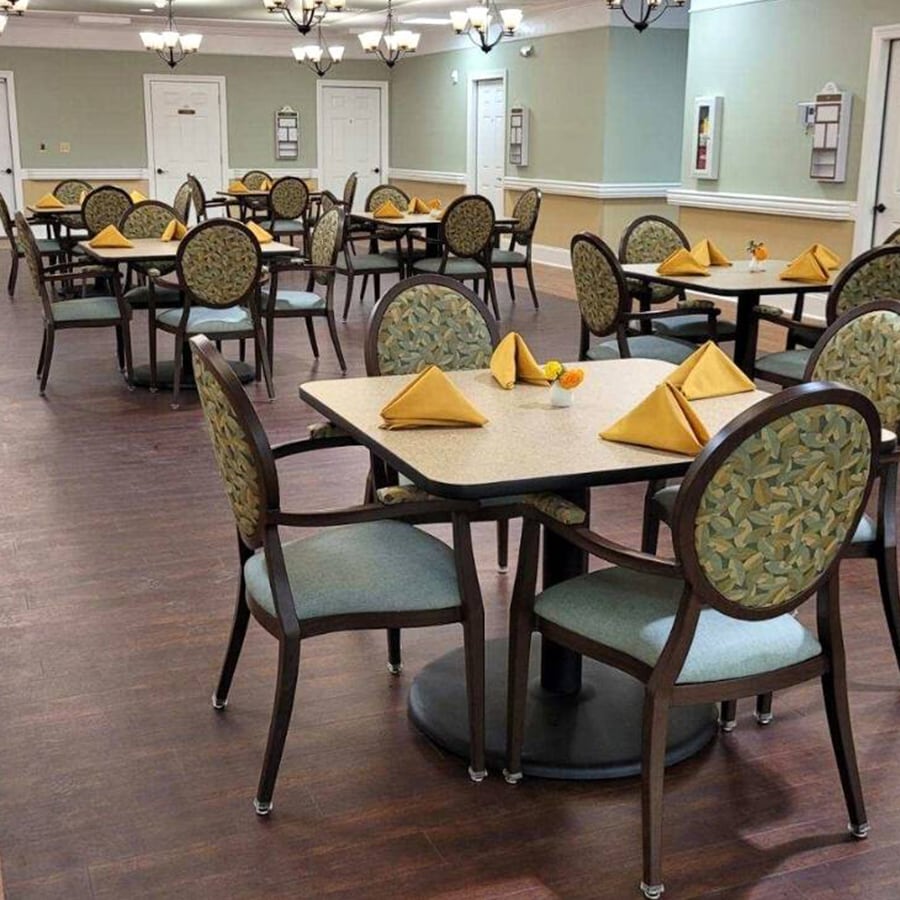 Dining room setup with tables and chairs