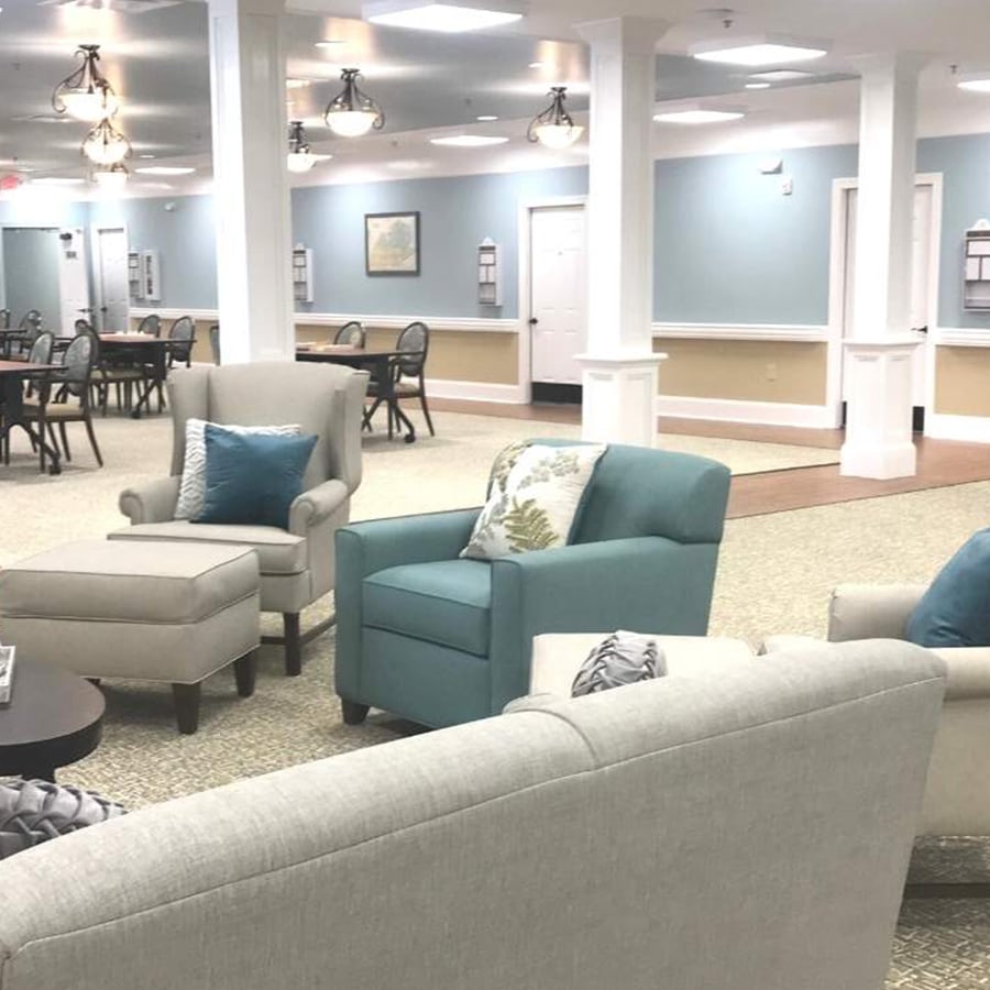 Bright common area with seating and dining space