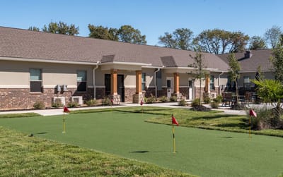 Outdoor putting green with flags for residents
