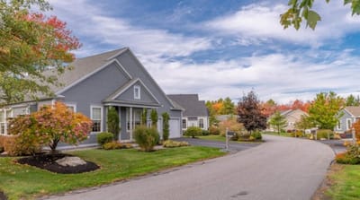 Exterior view of a senior living community with gardens