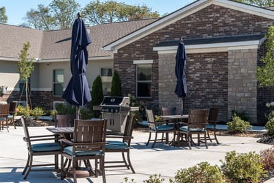 Outdoor seating area with tables and umbrellas
