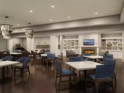 Interior view of a dining area with tables and chairs