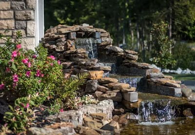 Beautiful outdoor water feature with flowers