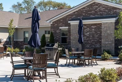 Outdoor seating area with tables and umbrellas
