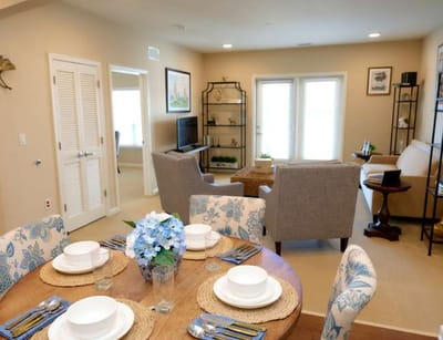A well-decorated dining room with table settings
