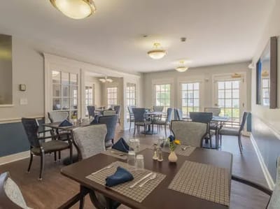 Dining area with tables and chairs set for a meal