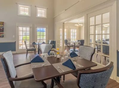 Dining area with tables set for residents