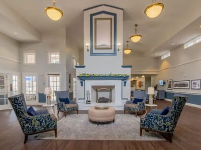 Bright common area with comfortable seating and fireplace