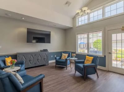Bright common area with seating and windows