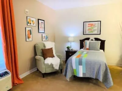 Cozy resident room with a single bed and decor