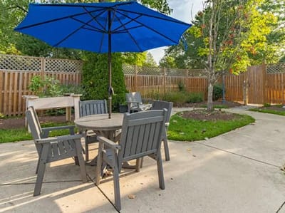 Outdoor seating area with table and umbrella