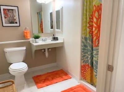 Bright bathroom with colorful decor and amenities