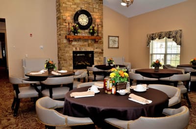 Elegant dining area with tables and floral arrangements