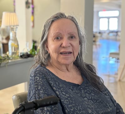 Resident smiling in a communal area
