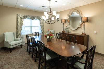 Dining area with a large table and decorative elements