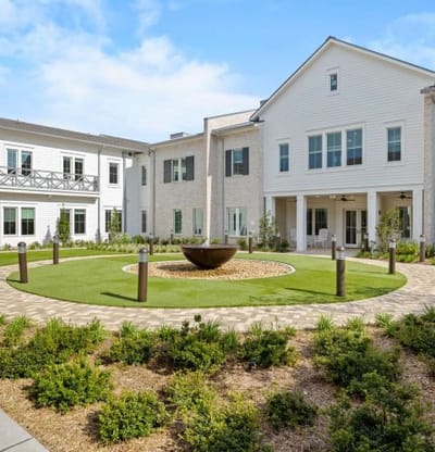 Outdoor courtyard featuring landscaping and seating areas