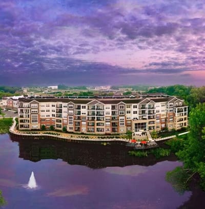 Aerial view of the Friendship Village facility next to a pond