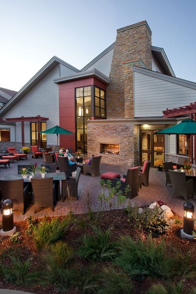 Outdoor patio area with residents enjoying the space