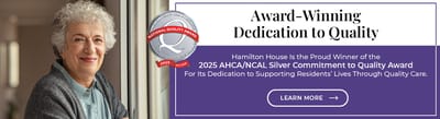 Woman smiling, promoting quality care award