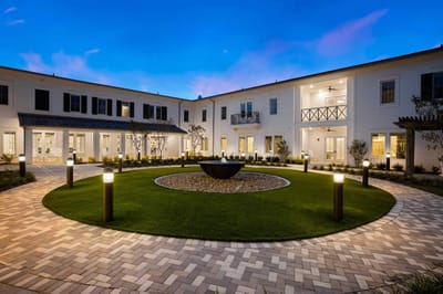 Courtyard with landscaped greenery and lighting